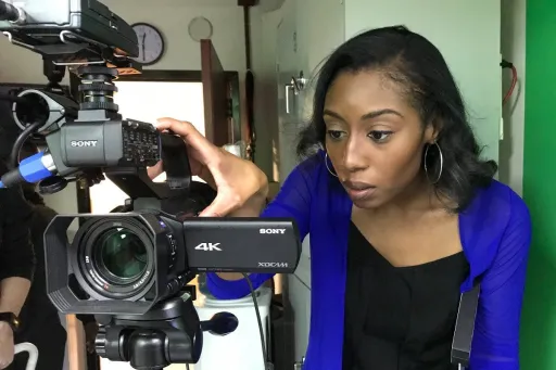 LaToya Smith behind a video camera