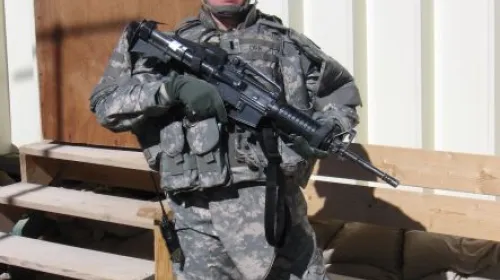 A picture of Jayme Rhodes in Army fatigues.