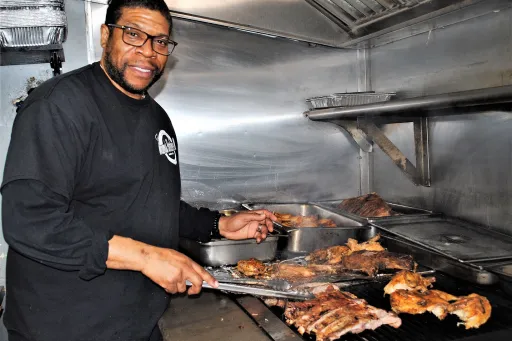 Chris Finnick at the grill at Mamas Southern Style BBQ
