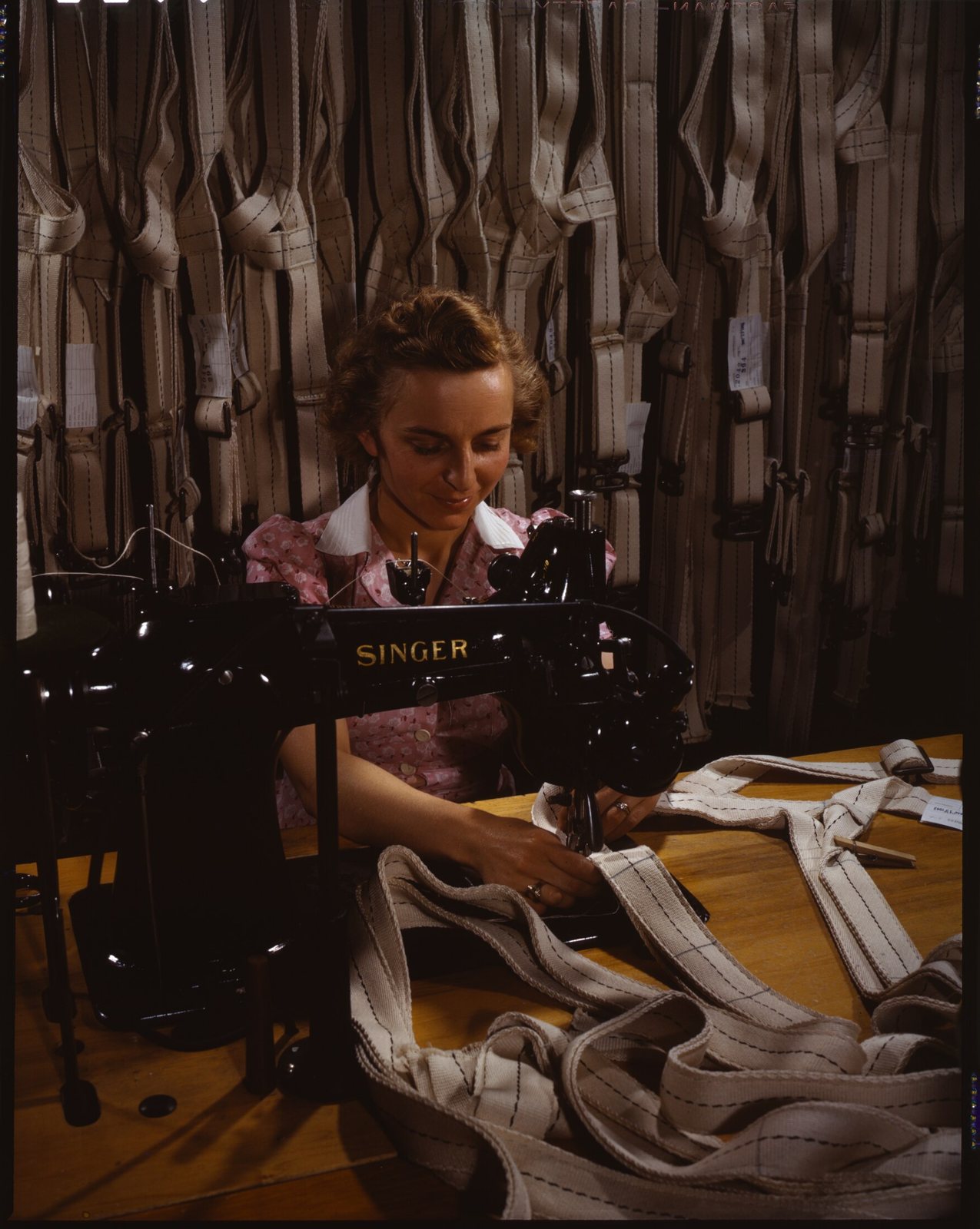 Stitching parachute harnesses at the Pioneer Parachute Company, Manchester, Connecticut, 1942. Library of Congress.