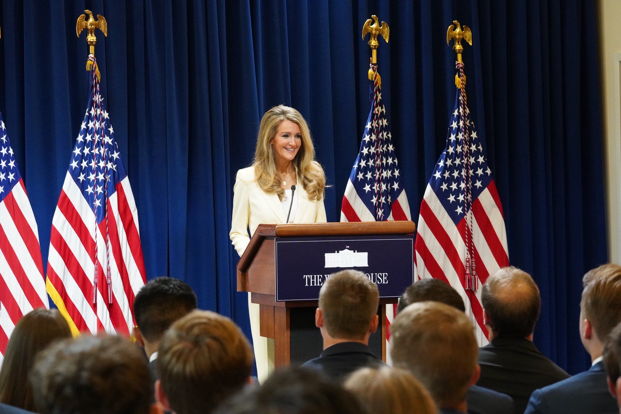 Administrator Kelly Loeffler speaks at a podium